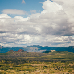 Beautiful landscape of Edziza provincial park in British Columbia Canada. Mountains in the distance. Clouds in the sky. Red Mountain. 