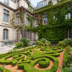 Beautiful ornate gardens of carnavalet museum in Paris