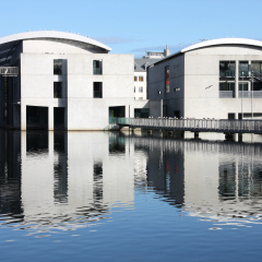 City Hall in Reykjavik, Iceland. Lake Tjorning reflection. Modern architecture.