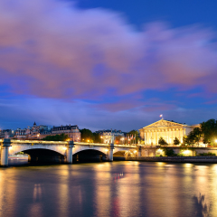 Paris River Seine with Pont de la Concorde and Assemblee Nationale at dusk
