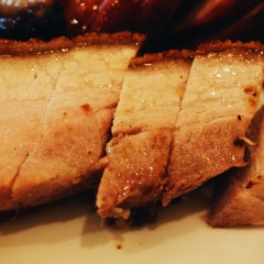 Roasted Crispy Pork,Cantonese cuisine. It is made by roasting entire pig with seasoning in charcoal furnace at high temperature.  Roasted pigs of high quality have crisp skin and juicy and tender meat