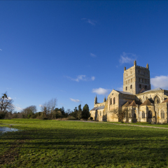 Tewkesbury Abbey, Gloucestershire, England founded by Robert FitzHamon in 1087 and completed in 1121. Surrounded by flood water.