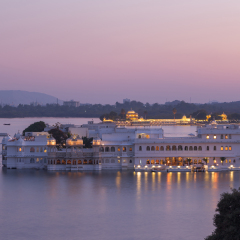 This photo was shot from Udaipur city at twilight time. Udaipur city palace was built over a period of nearly 400 years being contributed by several kings of the dynasty.  Focus at palace building.