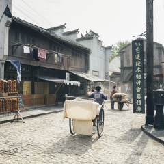 SHANGHAI, CHINA - MAY 6,2015: Chinses actors with props making movie in the recreated old shanghai street setup, film set, in Shanghai Film Park.
