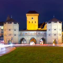 The Isartor gate, one of four main gates of the medieval city wall at night, Munich, Germany