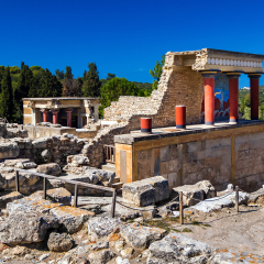 The ruins of the palace of Knossos in Greece, Crete. Red tower once majestic buildings. The chambers of the pharaoh, emperor. Great view. Nature summer.
