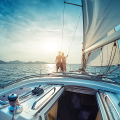 Young couple enjoying sunset on the yacht in Andaman sea