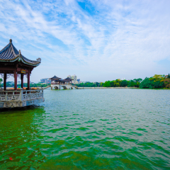 Traditional Chinese ancient architecture the pavilion  by the Huizhou West Lake's side, Huizhou city, Guangdong province, China. Chinese on the pavilion translate: "Pavilion of Ripples & Billowing"