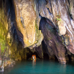 Tour boat paddling into the entrance of the Underground River Cave Tour in Sabang, Puerto Princesa - Palawan
