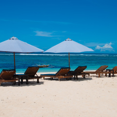 Sun loungers on the beach on the island of Bali in Indonesia. 