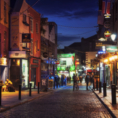 Blurred travel backgrounds - Nightlife at popular historical part of Dublin, Ireland - Temple Bar quarter. The area is the location of many bars, pubs and restaurants