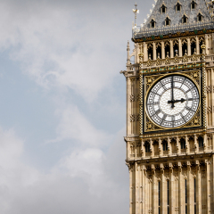 Big Ben, London, UK. A view of the popular London landmark, the clock tower known as Big Ben, showing 3pm as the time set against a blue and cloudy sky.