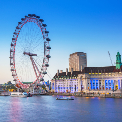 LONDON, ENGLAND - May 14, 2016 : The London Eye near the River Thames at dusk, England. The London Eye is a giant Ferris wheel on the South Bank of the River Thames in the capital of UK.