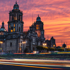 The sun rises over the Mexico City Metropolitan Cathedral in the Zocalo Square of Mexico City, Mexico.