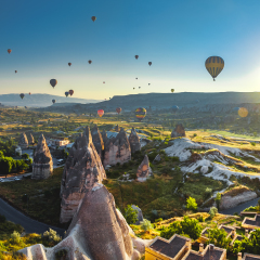 Hot air balloon flying over spectacular Cappadocia