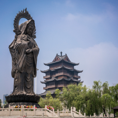Statue and tower at Guiyuan Buddhist Temple in Wuhan Hubei China