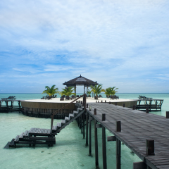 A man-made walkway Kapalai island with exotic tropical resort