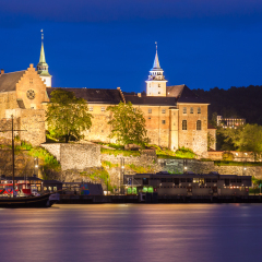Akershus fortress and castle at night in Oslo, Norway.