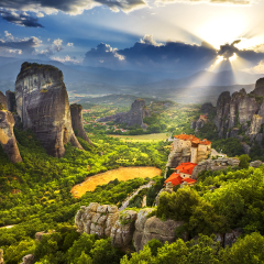 Greece. Meteora - incredible sandstone rock formations. The Holly Monastery of Rousanou and St. Nikolaos Anapafsas Monastery in background. The Meteora area is on UNESCO World Heritage List since 1988