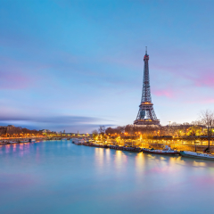 The Eiffel Tower and river Seine at twilight in Paris, France.