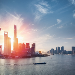 shanghai skyline against a blue sky with beautiful huangpu river