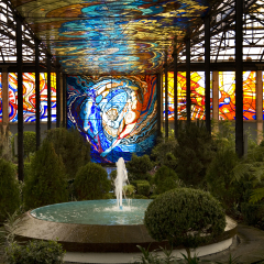 Cosmovitral Botanical Garden in Toluca, Mexico is surrounded by stained glass.  This side of the botanical garden represents chaos.