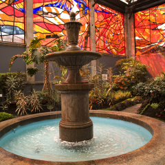 Cosmovitral is a very famous botanical garden in Toluca, Mexico, which is surrounded with stained glass.  This is one of the fountains.