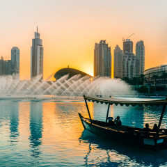 Singing fountains in Dubai. Dubai promenade singing fountains on the background of architecture. Dubai. In the summer of 2016.