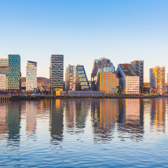Modern buildings in Oslo, Norway, with their reflection into the water. These are some of the new buildings in the neighbourhood of Bjorvika. Concepts of travel and architecture.