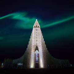 Northern lights shining over the church in Reykjavik Iceland