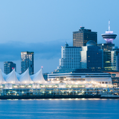 View of downtown Vancouver with Canada Place and Vancouver Lookout during sunrise blue hour