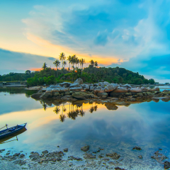 
Beauty sunset and boat fishermen village bintan island