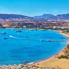 Sharm El Maya is one of the central districts of resort, that boasts scenic rocky landscape and beautiful beaches with palms and multiple sunshades, Sharm El Sheikh, Egypt.