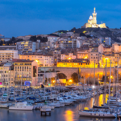 Marseille, France at night. The famous european harbour view on the Notre Dame de la Garde
