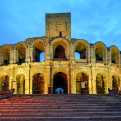 Roman amphitheatre in Arles, France, illuminated at late evening