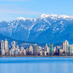 Fantastic view over ocean, yacht and snow mountains in Vancouver, Canada.