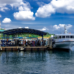 Jetty punggur batam island indonesia 30.12.2016 a clear blue sky day at ferry jetty, the ferry is tranport to tranfer a citizenfrom batam island to tanjung pinang