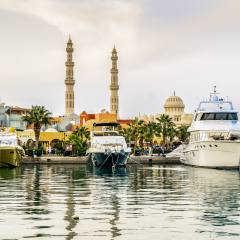 Yachts berthed at the port of Hurghada, Hurghada Marina at sunset against the mosque, April 15, 2014,Egypt