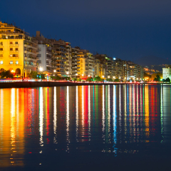Embankment of Thessaloniki with reflection in the sea at twilight. Greece