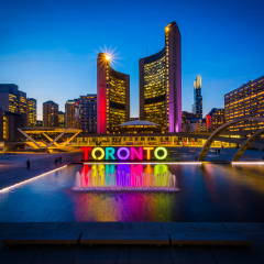 View of Nathan Phillips Square and Toronto Sign in downtown at night, in Toronto, Ontario.