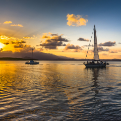 afternoon sunset cloudburst Coral sea Port Douglas Queensland calm ocean reflections Daintree background