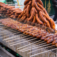 Traditional chinese sausages cooking on the streets of Harbin, China in winter