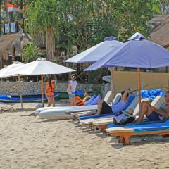 BALI, INDONESIA - SEPTEMBER 13, 2015: Tourists on Mushroom Beach at Nusa Lembongan Island, Bali on Sep 13, 2015. This island is located on Southeast of Bali and popular destination to dive and surf.