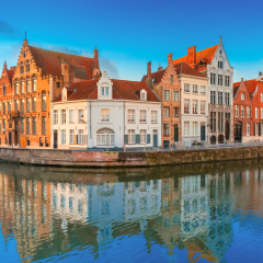 Scenic city view of Bruges canal Spiegelrei with beautiful medieval houses and reflections, Belgium