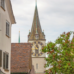 Zurich, Switzerland - June 10, 2017: Church Saint Peter, view through houses in downtown Zurich-