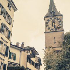  Clock tower of St. Peter church, Zurich, Switzerland. Vintage toned photo, old style effect
