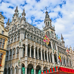 BRUSSELS, BELGIUM - JUNE 29, 2010: The King's House on the Grand Place decorated with old religious flags before the Ommegang celebration, on June 29 in Brussels.