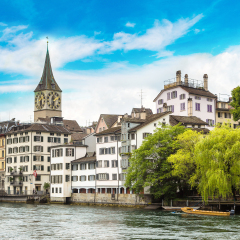 Clock tower in historical part of Zurich in a beautiful summer day, Switzerland