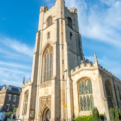 CAMBRIDGE - MAY 23: Church of Saint Mary the Great, Gothic architecture building in Cambridge, England, under cloudy blue sky, on May 23, 2016.