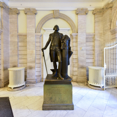 New York City - Mar 29 2017: George Washington Monument  in New York City Hall, the seat of NYC government, located at the center of City Hall Park in Lower Manhattan.